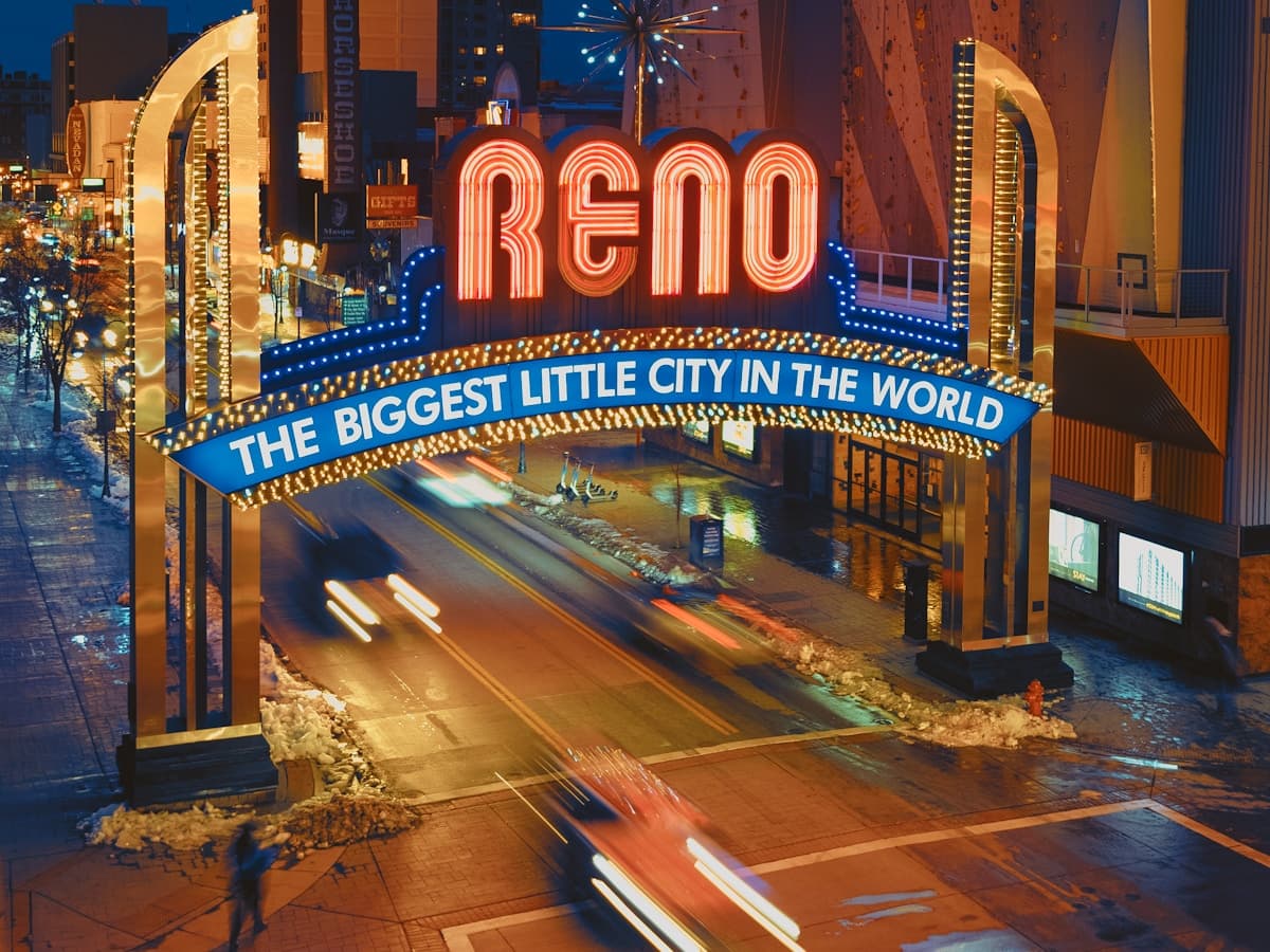 The iconic 'Reno: The Biggest Little City in the World' neon arch lit at night above downtown.