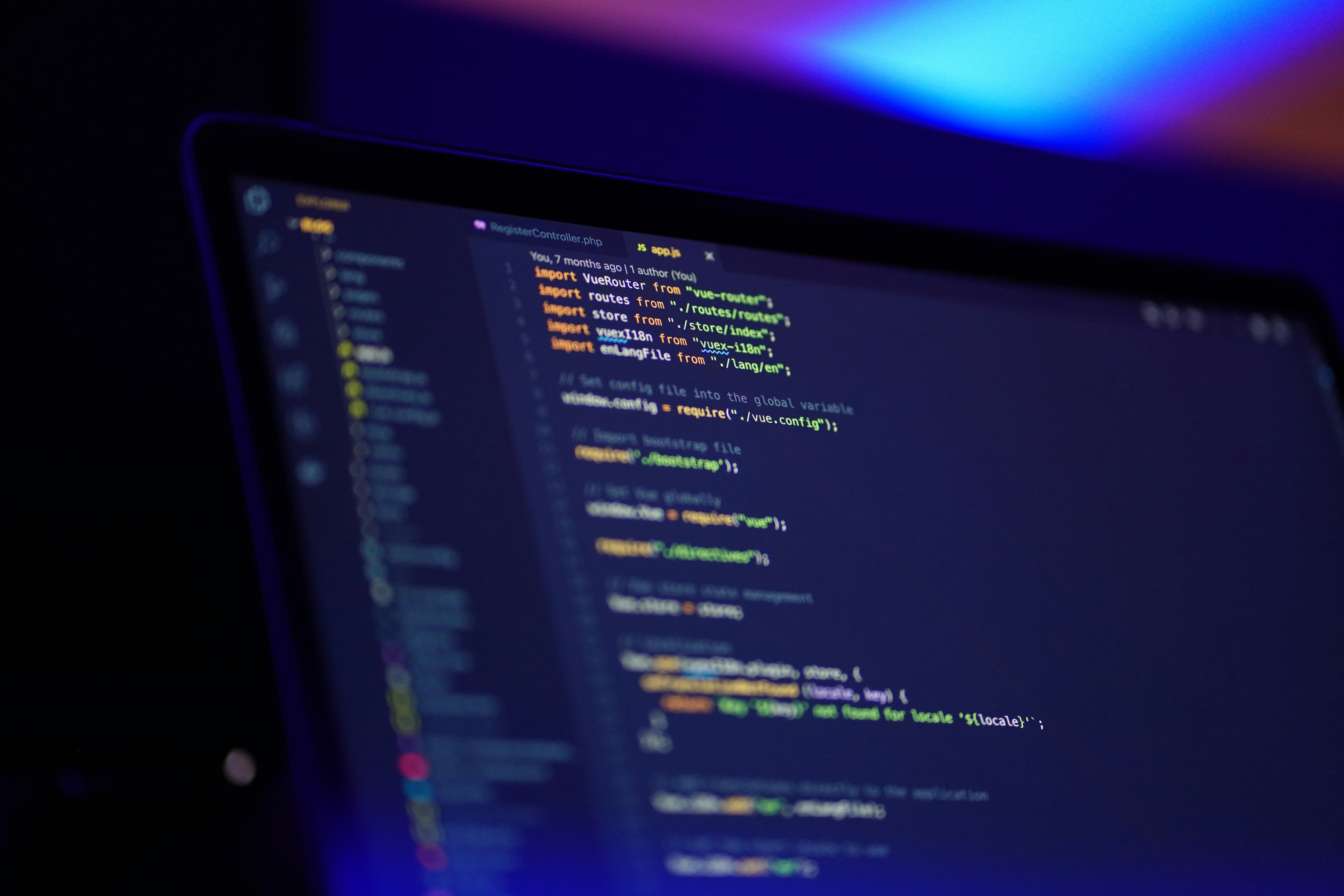 Code editor under ambient purple and blue studio lighting