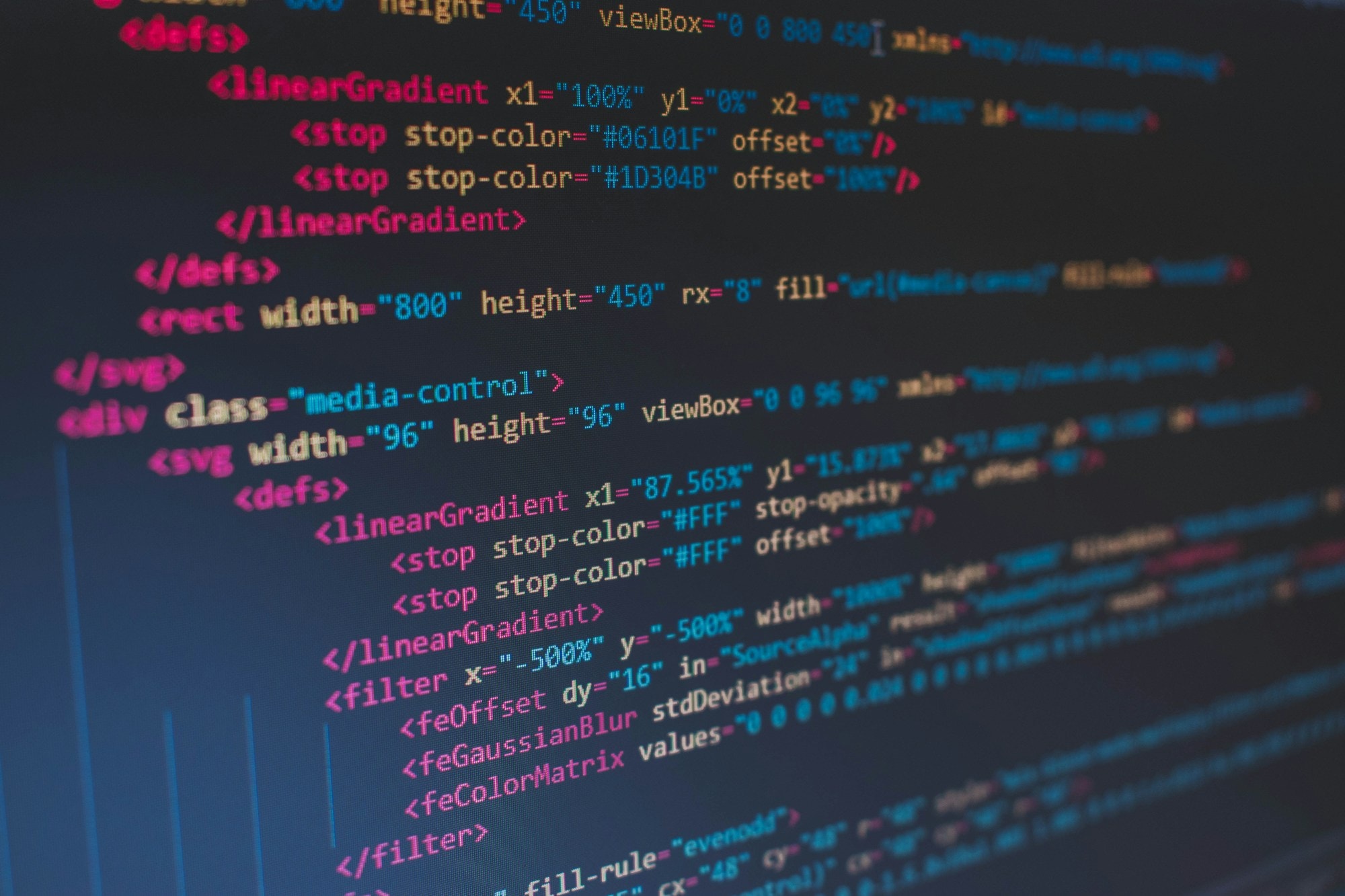 Code on a dark monitor — the moment you decide whether to write your own or rent someone else's.