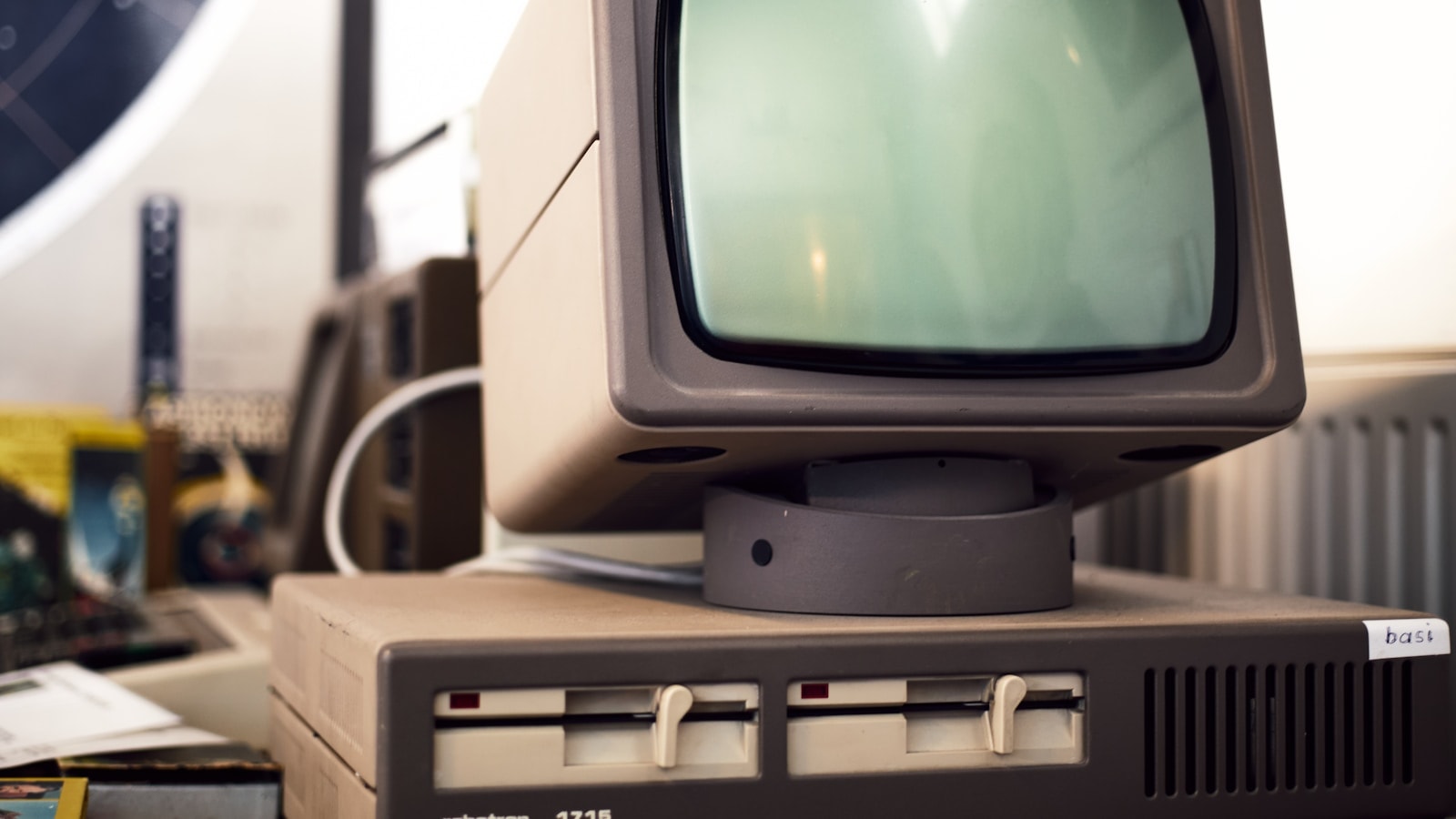Vintage computer monitor and disk drives from a museum exhibition — a literal artifact of the era when Google's ranking algorithm was first being built.